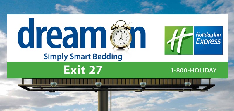 Billboard for Holiday Inn Express featuring "dreamon" branding, promoting smart bedding with an alarm clock graphic and directions to Exit 27.