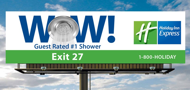 Billboard promoting Holiday Inn Express, featuring the phrase "Guest Rated #1 Shower," with a showerhead graphic. Located near Exit 27.